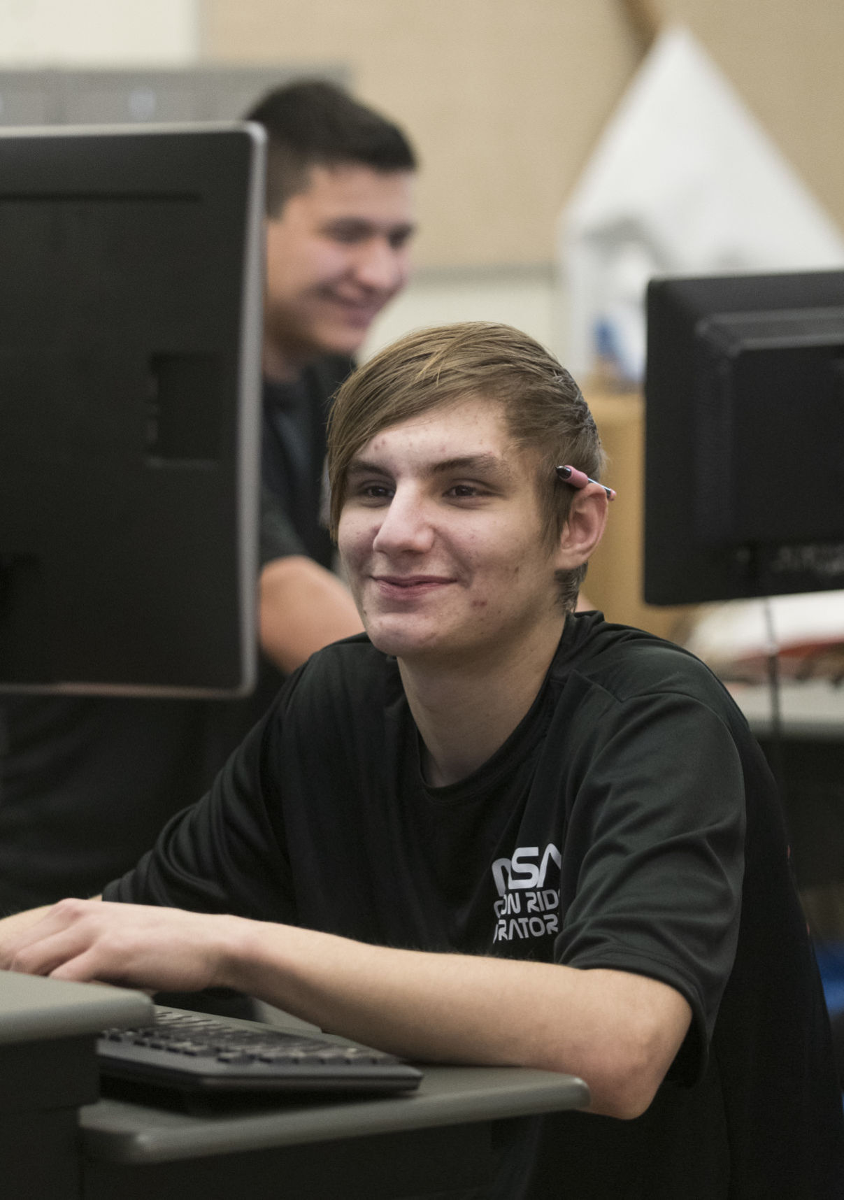High schoolers making spaceship parts